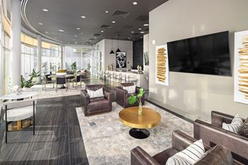 a living room with couches a table and a television